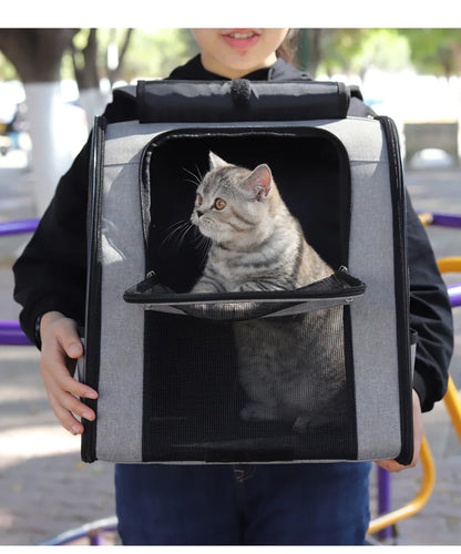 Gray and purple waterproof pet carrier with mesh ventilation, held by a person